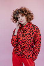 Load image into Gallery viewer, Funnel Neck Pullover in Orange Squiggle Print